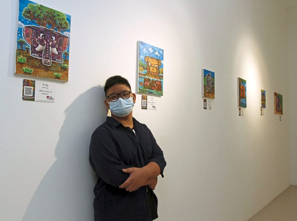 Yew Boy says the art exhibition builds his self-confidence and motivates him to try different styles of painting.